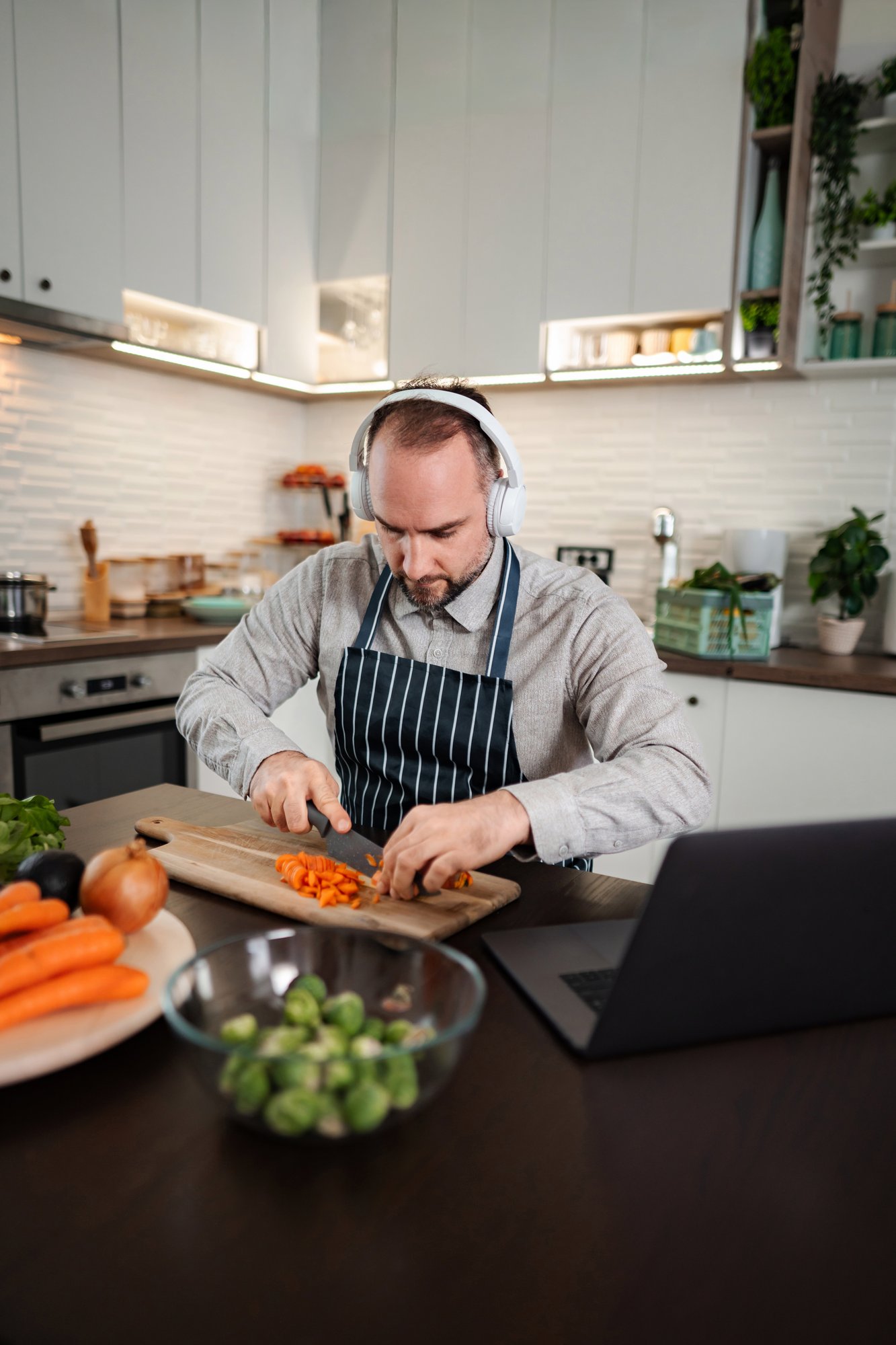 Instructor teaching a home cook via webcam